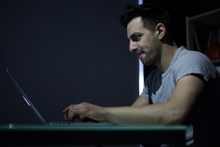 businessman working with computer at night at home