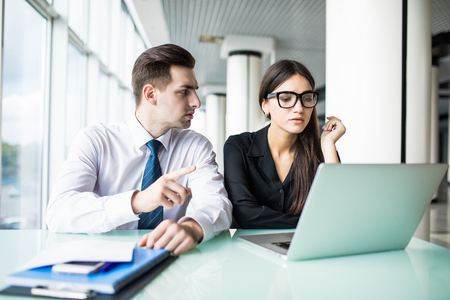 investment advisor businesswoman consulting with young financial businessman.の写真素材