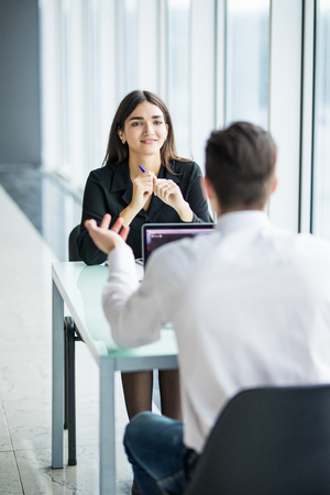 Business people Having Meeting Around Table In Modern Office