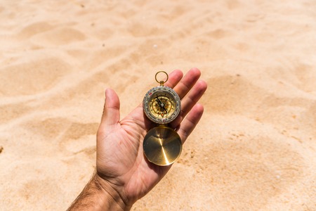 Compass in tourist woman hand close up. Travel concept.の写真素材