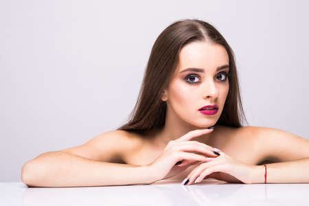 Glamour portrait of beautiful woman model with fresh daily makeup and romantic wavy hairstyle.の写真素材