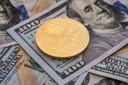 Golden bitcoin coins on a paper dollars money and dark background with sun. Virtual currency. Crypto currency. New virtual money Dollars money. Lens flareの写真素材