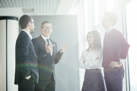 Business people discussing on informal meeting in officeの写真素材
