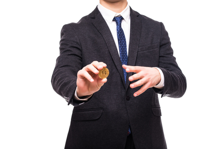 Close up of bitcoin in man hands isolated on whiteの写真素材