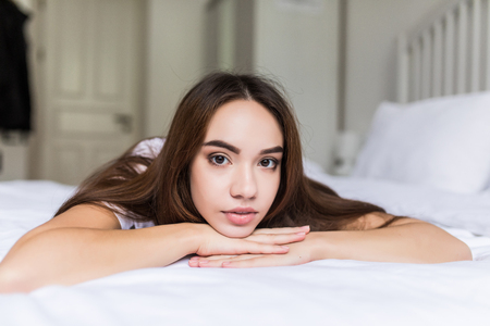 Close up morning portrait of smiling pretty woman with green eyes, sensual fresh happy face, positive emotions.の写真素材