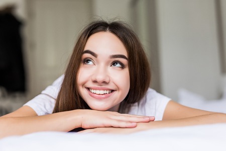 Close up morning portrait of smiling pretty woman with green eyes, sensual fresh happy face, positive emotions.の写真素材