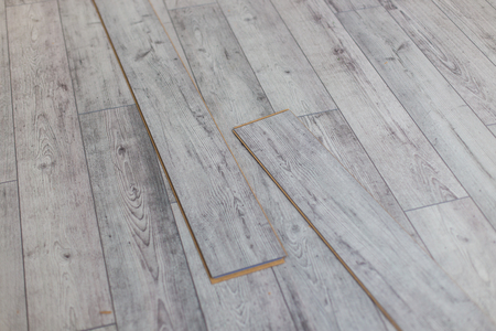 Wooden gray panels on new laminated flooringの写真素材