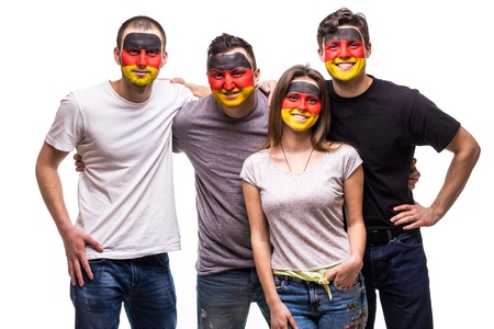 Group of people supporters fans of Germany national teams with painted flag face. Fans emotions.の写真素材