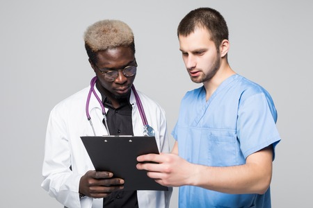 Two male doctors with isolated white background.の写真素材