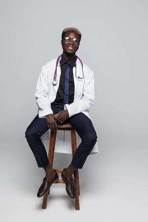 African Medical doctor man isolated on grayの写真素材