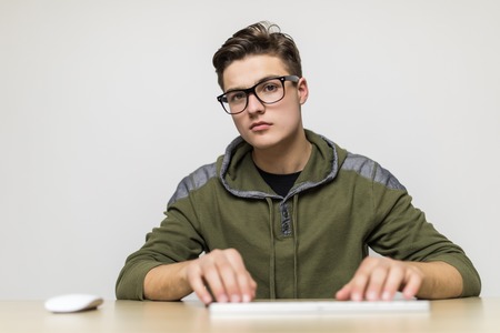 Close up shot of a man's hand typing on the computer keyboard.の写真素材
