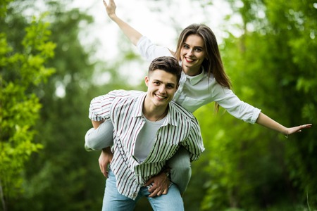 Outdoor Portrait Of Romantic Young Couple In Park