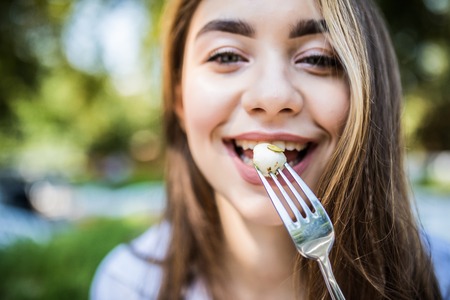 Beautiful healthy woman eating salad, Dieting Concept. Healthy Lifestyle.