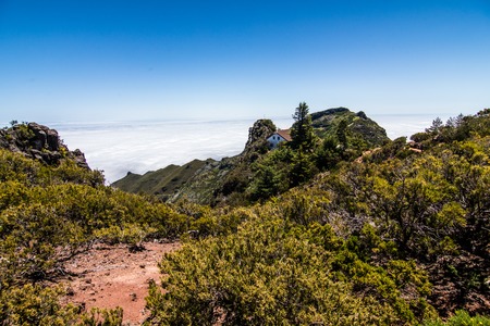 clouds and peaks at the top of the highest mountain of Madeira - Pico Ruivo, Portugalの写真素材