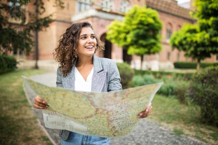 travel guide, tourism in Europe, woman tourist with map on the street