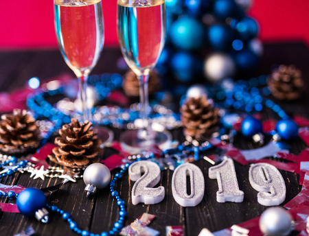 New year composition with champagne and space for text against blurred Christmas lightsの写真素材