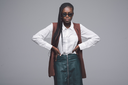 Portrait of african american woman in sunglasses isolated on grey backgroundの写真素材