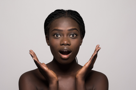 Portrait of surprised beautiful girl with open mouth, isolated on whiteの写真素材