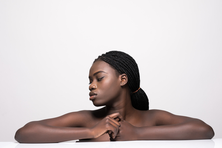 Beautiful sensual woman touching her face. Beauty and skincare concept. Spa. Isolated over white.の写真素材