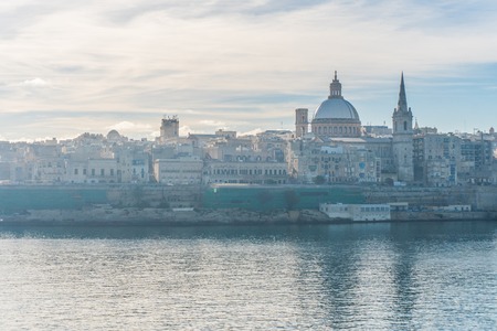 view on Valletta with its architecture from the sea with reflectionの写真素材