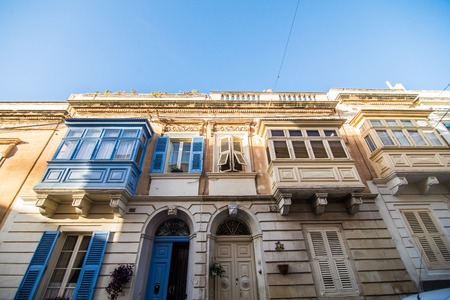 Typical narrow streets with colorful balconies in Valletta at Maltaのeditorial素材