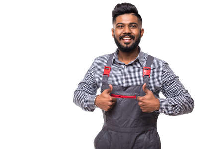 Side view of young delivery man with box. isolated gray backgroundの写真素材