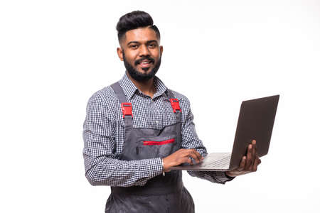 Side view of young delivery man with box. isolated gray background