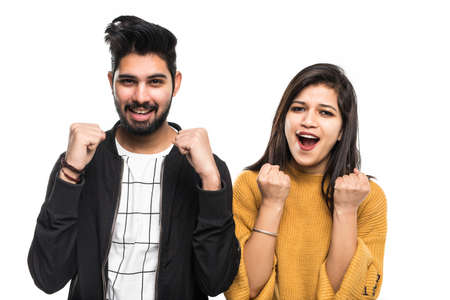 Young indian couple take selfie on green background