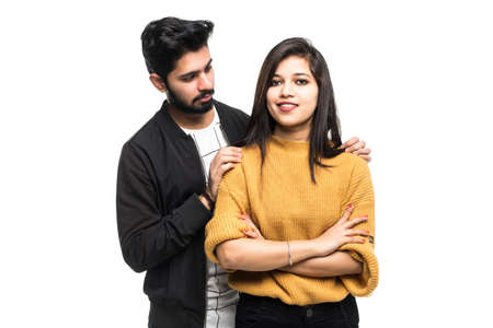 Young indian couple take selfie on green backgroundの写真素材