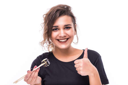 Young girl holding plate of sushi in her hands