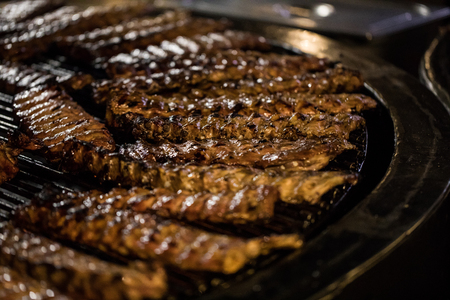 Grilled pork ribs on the grill.の写真素材
