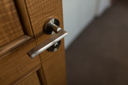 Detail of Modern style metallic door handle on doorの写真素材