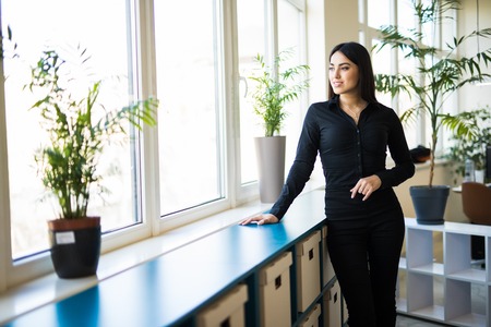 Modern business woman in the office with copy space