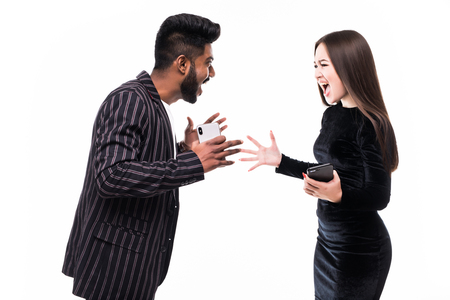 Angry couple shouting at each other on white background