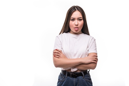 Portrait of asian girl in casual wear sticking out her tongue, feeling uncomfortable