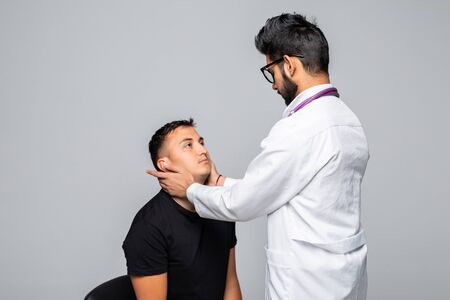 medicine, healthcare and people concept - smiling doctor giving prescription to patient at hospitalの写真素材
