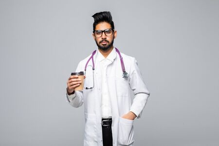 Medic or doctor taking coffee break concept isolated on white backgroundの写真素材