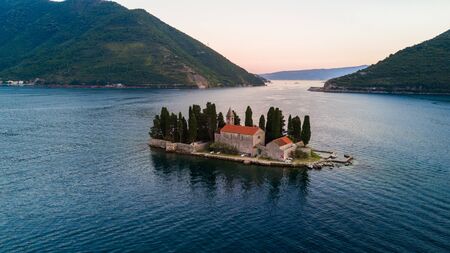 The small islands of Ostrvo and Sveti Juraj monastery in the bay of Kotor, Montenegroの写真素材