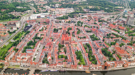 Gdansk, Poland. Aerial skyline panorama with Motlawa river, modern drawbridge, concert hall and all famous monuments in the background: medieval crane, St Mary and St John churches, city hall towerのeditorial素材