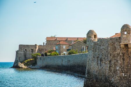 Old Town Budva, Montenegro. The first mention of this city - more than 26 centuries ago. We see ancient houses, a very narrow street, cafes, shops.の写真素材
