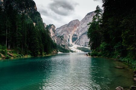 Spectacular romantic place with typical wooden boats on the alpine lake,,Dolomites,South Tyrol,Italy,Europeの写真素材