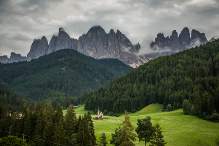 Dolomites, Italy - July, 2019: Famous best alpine place of the world, Santa Maddalena village with Dolomites mountains in background, Val di Funes valleyのeditorial素材