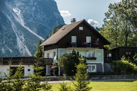 Austria - July, 2019: Asphalt road in Austria, Alps in a beautiful summer day