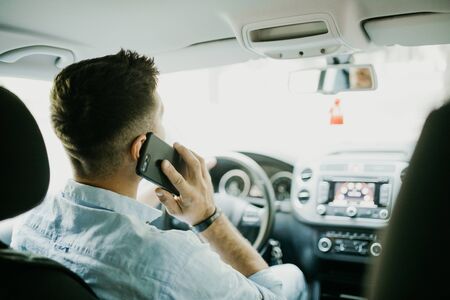 transport, business trip, technology and people concept - close up of young man with smartphone...