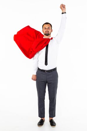 Young business man hero with fist up on white backgroundの写真素材