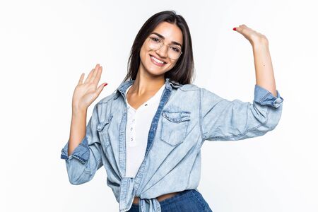 Beautiful young woman dancing isolated on white backgroundの写真素材