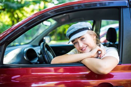 Side View Of A Young Happy Woman Driving Car
