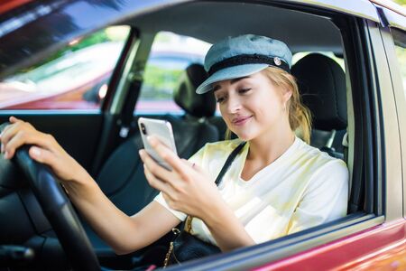 Young Woman Sending Messages while Driving