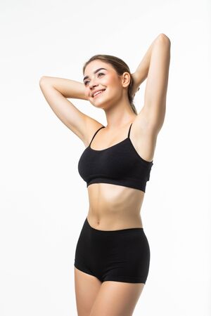 Young woman with perfect body wear in black underwear isolated on white backgroundの写真素材
