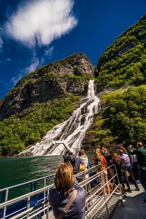 Geiranger, Norway - June, 2019: Hurtigruten cruise liner sailing on the Geirangerfjord, one of the most popular destination in Norway and UNESCO World Heritage Site. Geirangerのeditorial素材